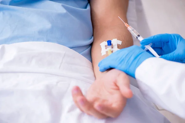 Male patient in blood transfusion concept — Stock Photo, Image