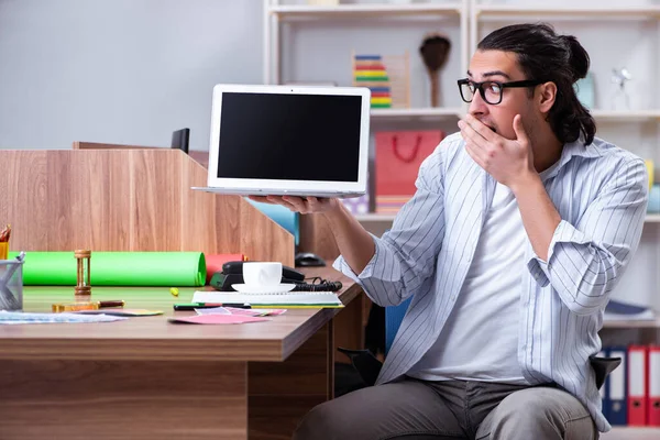 Young male designer working in the office — Stock Photo, Image