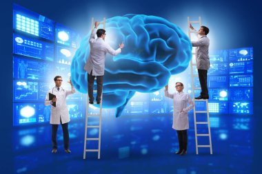 Bir grup doktor insan beynini inceliyor.