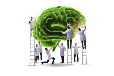 Bir grup doktor insan beynini inceliyor.