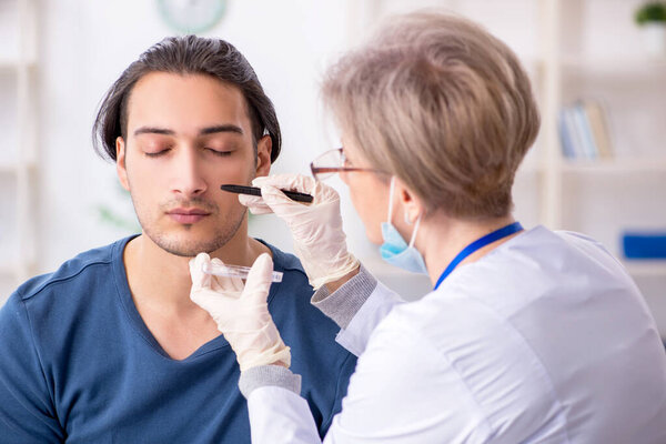 Young patient visiting doctor in hospital