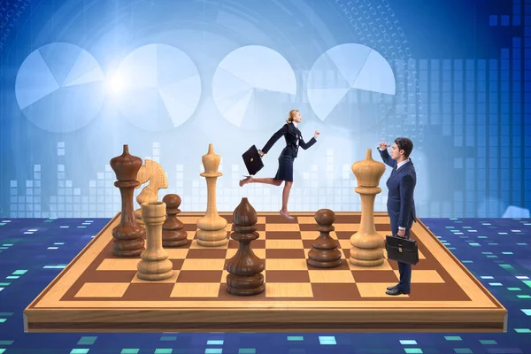 Businessman in large chess board in strategy concept — Stock Photo, Image