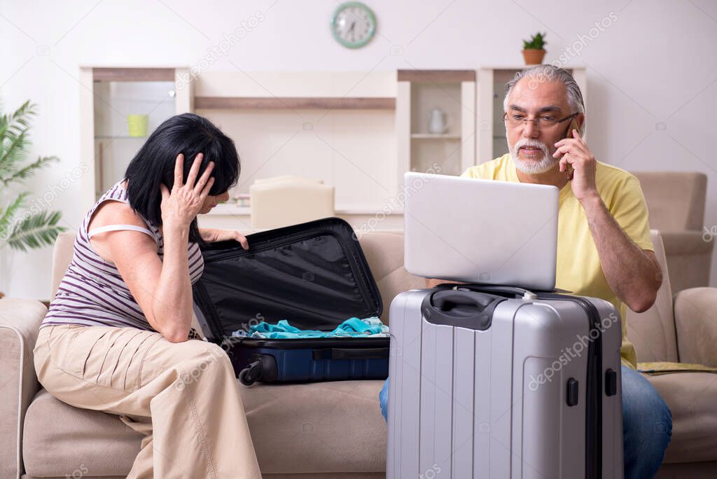 Old couple preparing for vacation travel