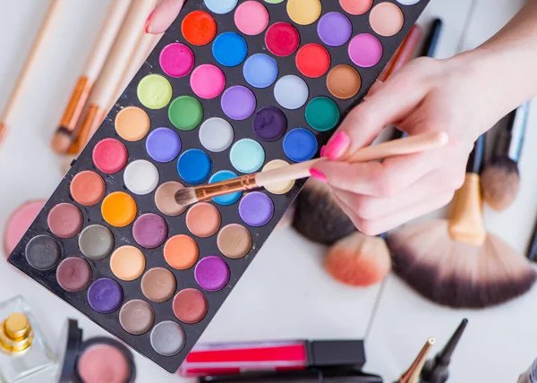 Collection of make up products displayed on the table — Stock Photo, Image