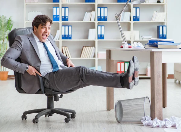 Businessman having fun taking a break in the office at work