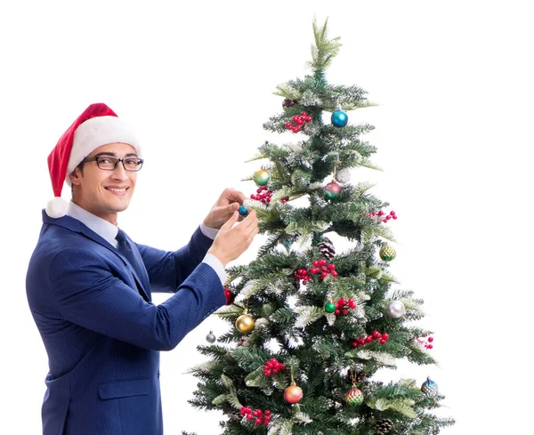 Businessman decorating christmas tree isolated on white Stock Photo