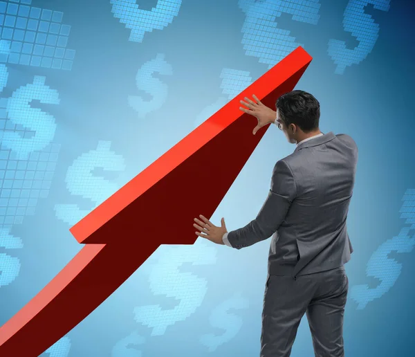 Affärsman som stöder tillväxten i ekonomin i diagrammet — Stockfoto