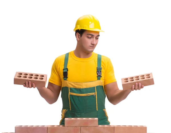 The handsome construction worker building brick wall — Stock Photo, Image