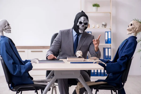 Funny business meeting with devil and skeletons