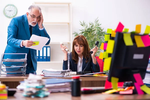 Two employees and excessive work in the office — Stock Photo, Image