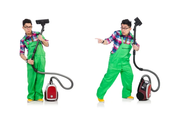 Vtipný muž v zelených kombinézách vakuové čištění — Stock fotografie