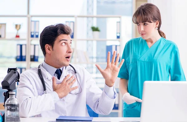 Doctor angry at his assistant due to medical error