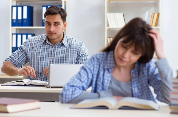 Students sitting and studying in classroom college Royalty Free Stock Images