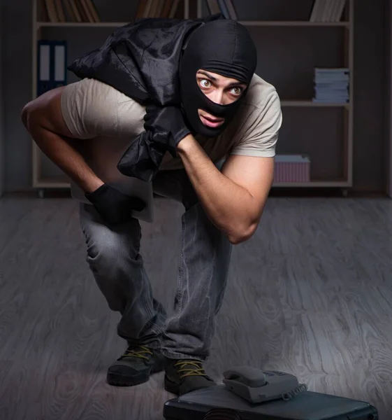 Burglar wearing balaclava mask at crime scene — Stock Photo, Image