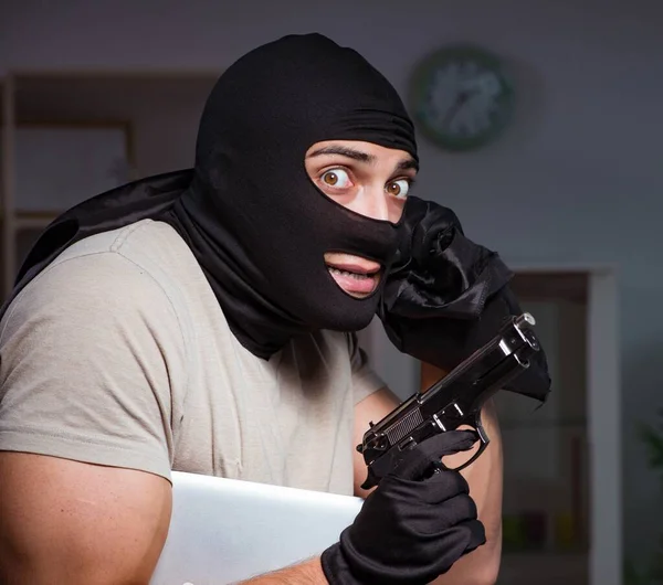 Burglar wearing balaclava mask at crime scene — Stock Photo, Image