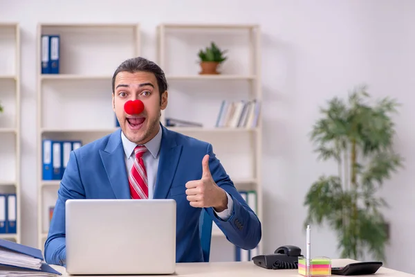 Funny employee clown working in the office — Stock Photo, Image