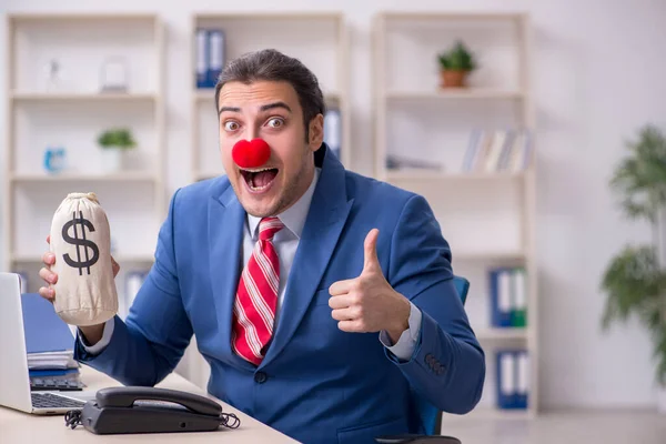 Funny employee clown working in the office — Stock Photo, Image