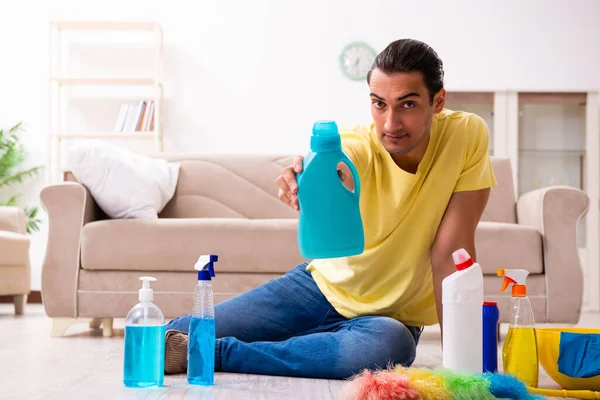 Young male contractor doing housework at home — Stock Photo, Image