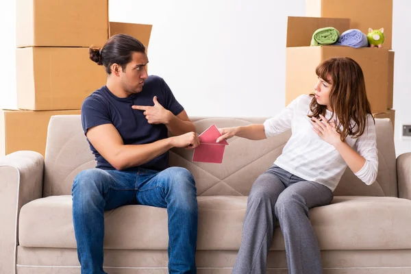 Young pair and many boxes in divorce settlement concept