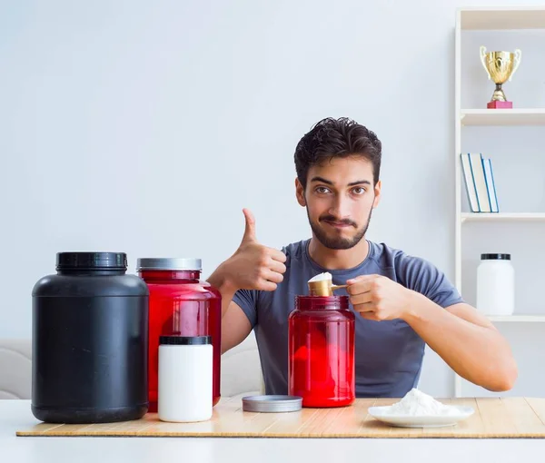 Athlete tasting new protein supplements for better muscles — Stock Photo, Image