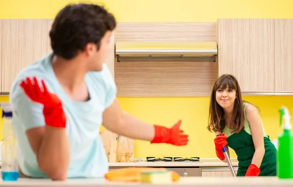 Young couple working at kitchen — Stock Photo, Image