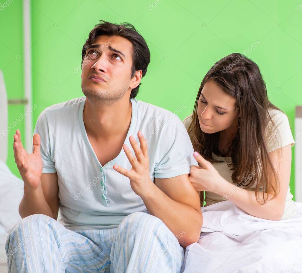 Young woman consoling disappointed impotent husband
