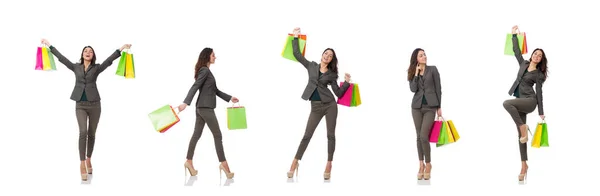 Mulher atraente com sacos de compras isolados em branco — Fotografia de Stock