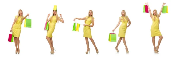 Vrouw met veel boodschappentassen op wit — Stockfoto