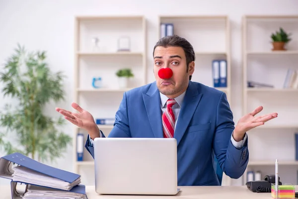 Funny employee clown working in the office — Stock Photo, Image