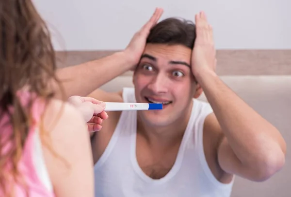 The young family with pregnancy test results — Stock Photo, Image