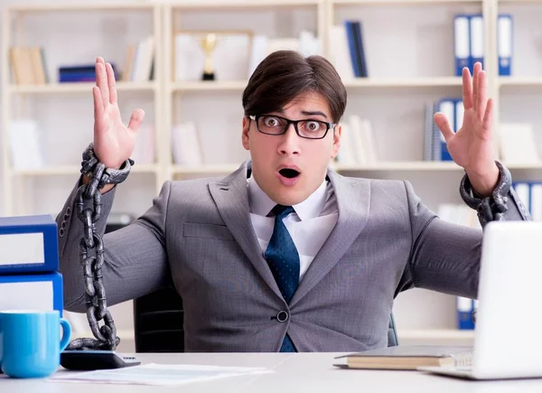 The businessman tied with chains to his work — Stock Photo, Image