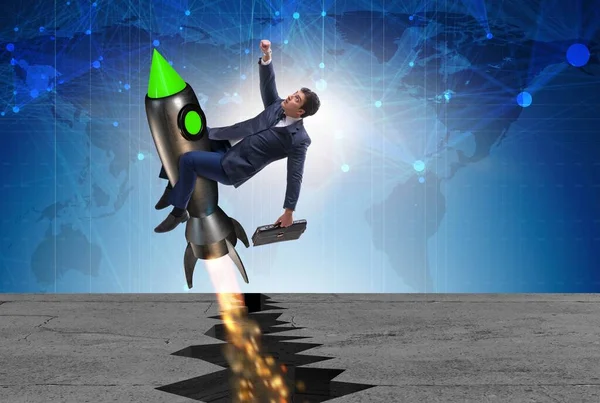 Бізнесмен летить на ракеті з розриву каменю — стокове фото
