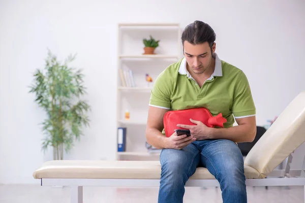 Young man waiting for doctor in the clinic — Stock Photo, Image