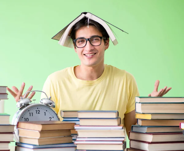 Student with too many books to read before exam — Stock Photo, Image