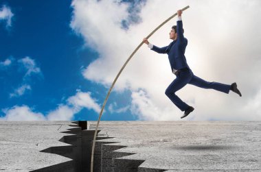 Sırıkla atlama konseptinde iş adamı