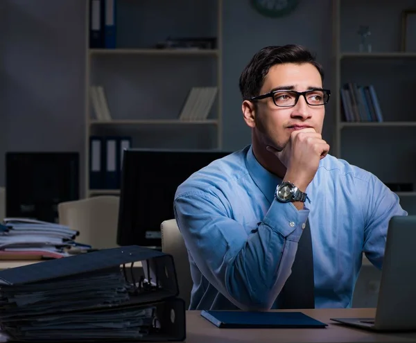 Employee working late at night at important report — Stock Photo, Image