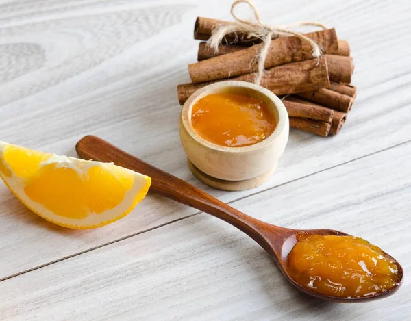 Orange jam served in spoon on the table — Stock Photo, Image