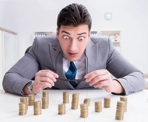 Businessman with golden coins in business growth concept — Stock Photo, Image