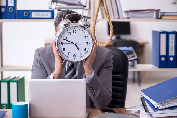 Young male employee committing suicide at workplace — Stock Photo, Image