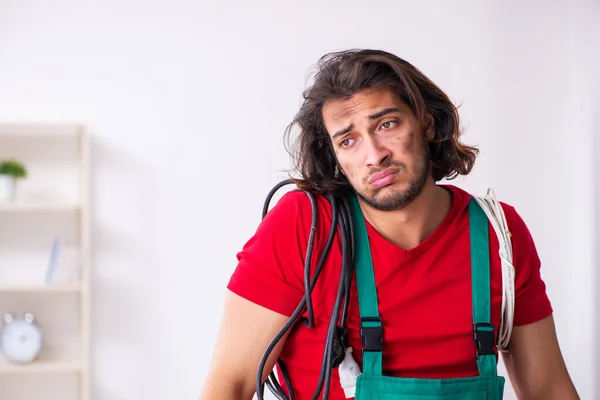 Funny young male electrician working indoors — Stock Photo, Image