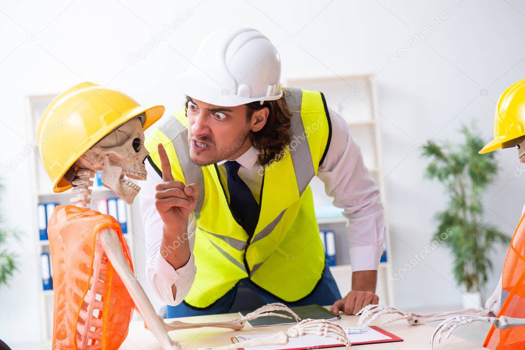 Funny construction business meeting with boss and skeletons