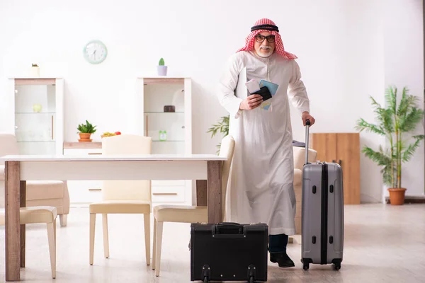 Old arab businessman preparing for business trip