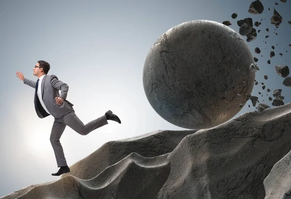 Бізнесмен втікає від падаючого прокатного каменю — стокове фото