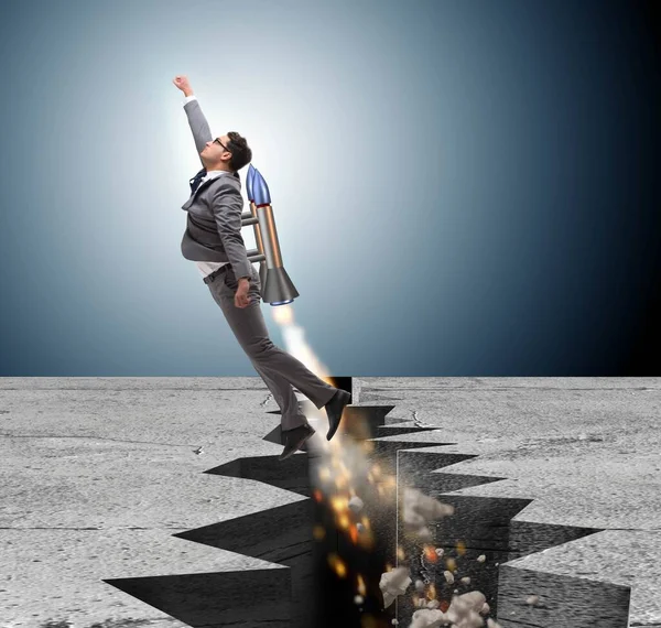 Бізнесмен летить на ракеті з розриву каменю — стокове фото
