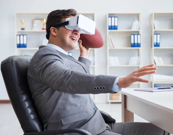 Businessman playing virtual reality football in office with VR g — Stock Photo, Image