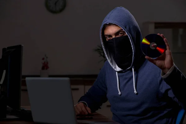 Male hacker hacking security firewall late in office — Stock Photo, Image