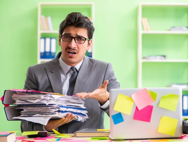 Businessman unhappy with many conflicting priorities sitting in — Stock Photo, Image