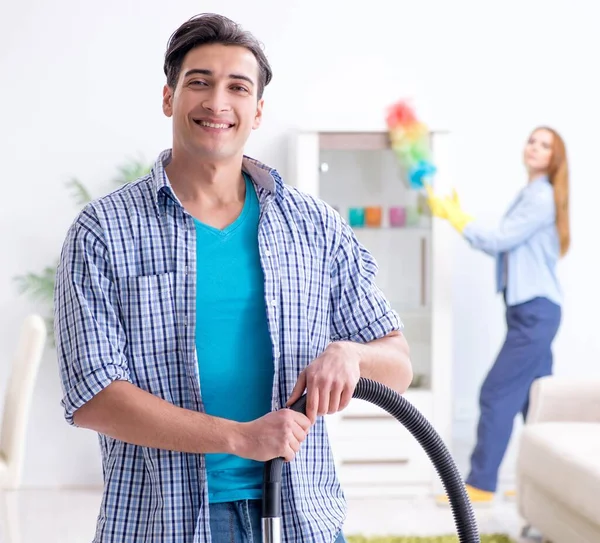 Young family cleaning the house — Stock Photo, Image