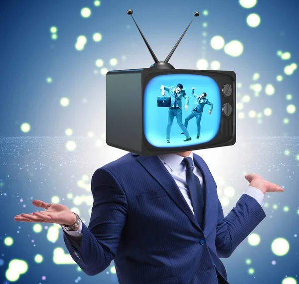 Man with television head in tv addiction concept