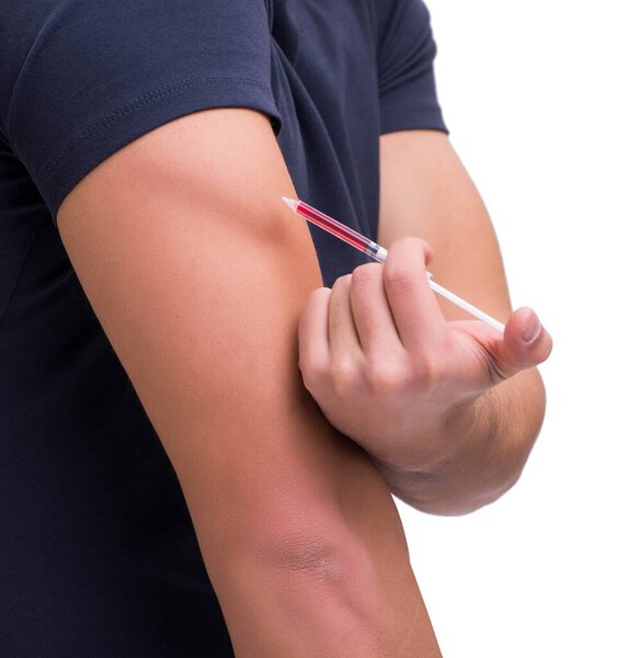 Young man in doping concept isolated on white